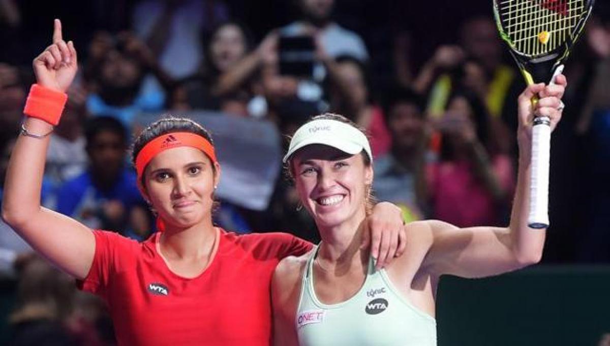 Sania Mirza beats former partner Martina Hingis to top WTA doubles ranking